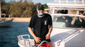 Black Ops Cap worn on a Makocraft boat