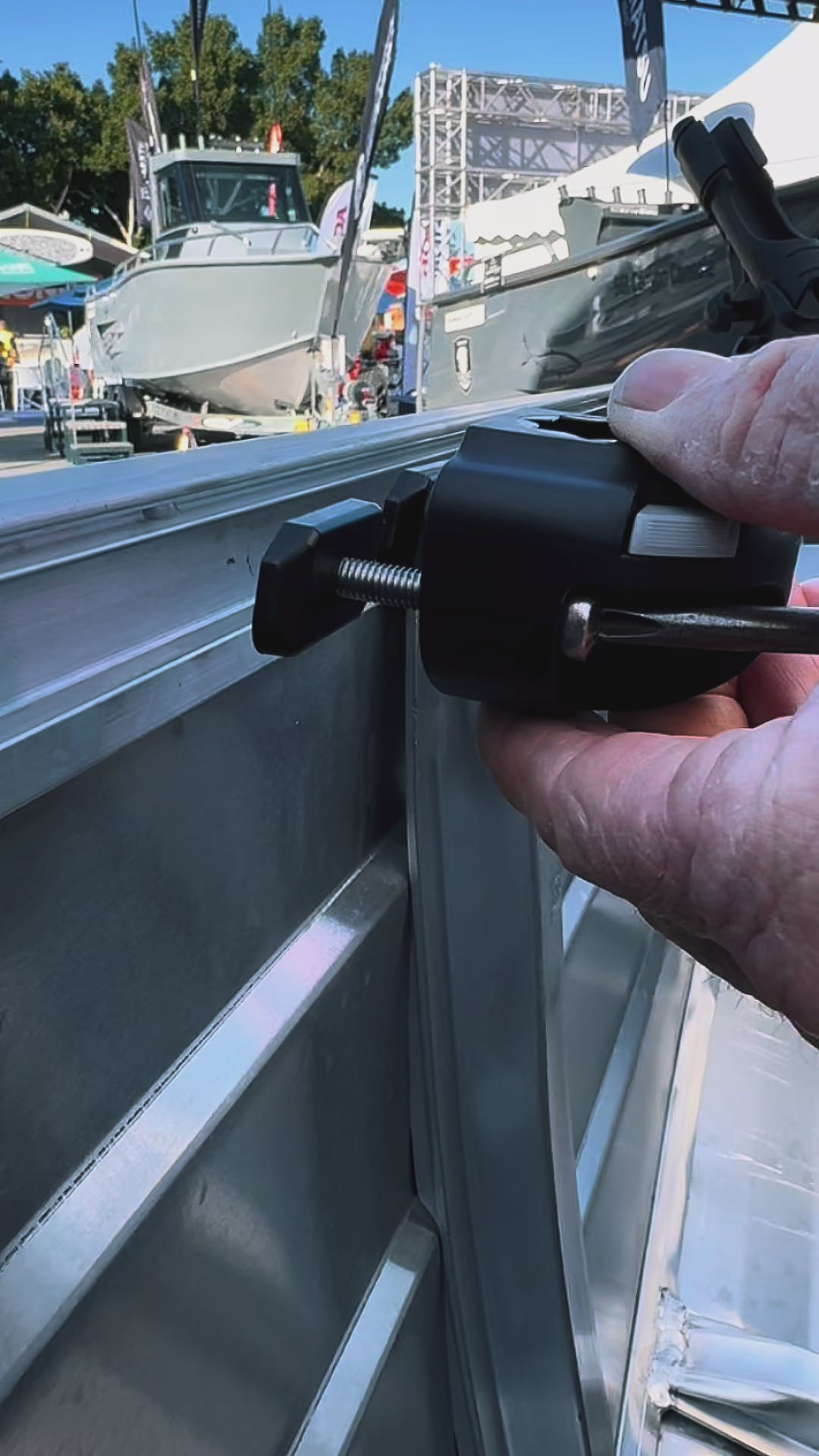Fitting a Makocraft Railblaza mount to the gunnel and clicking in a rod holder